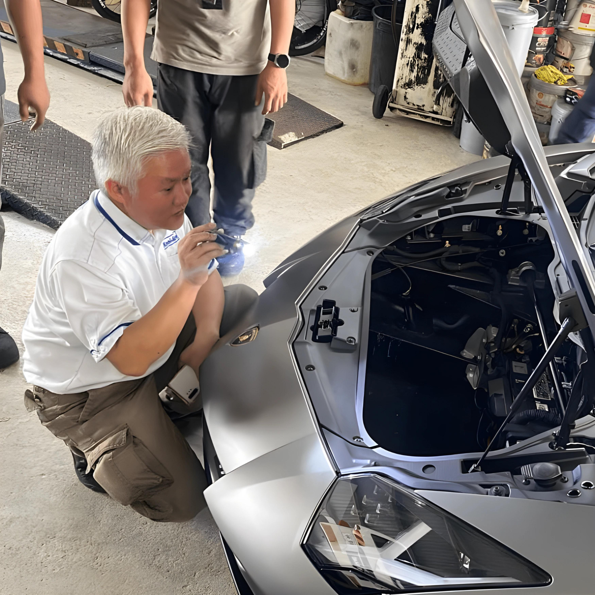 Kool-Aire specialist inspecting a vehicle aircond system